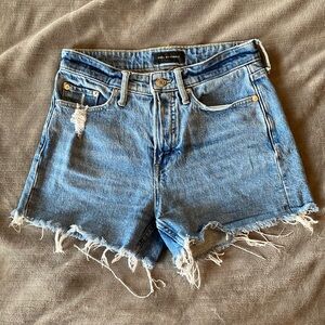 Lightly distressed denim shorts, very flattering with modest coverage